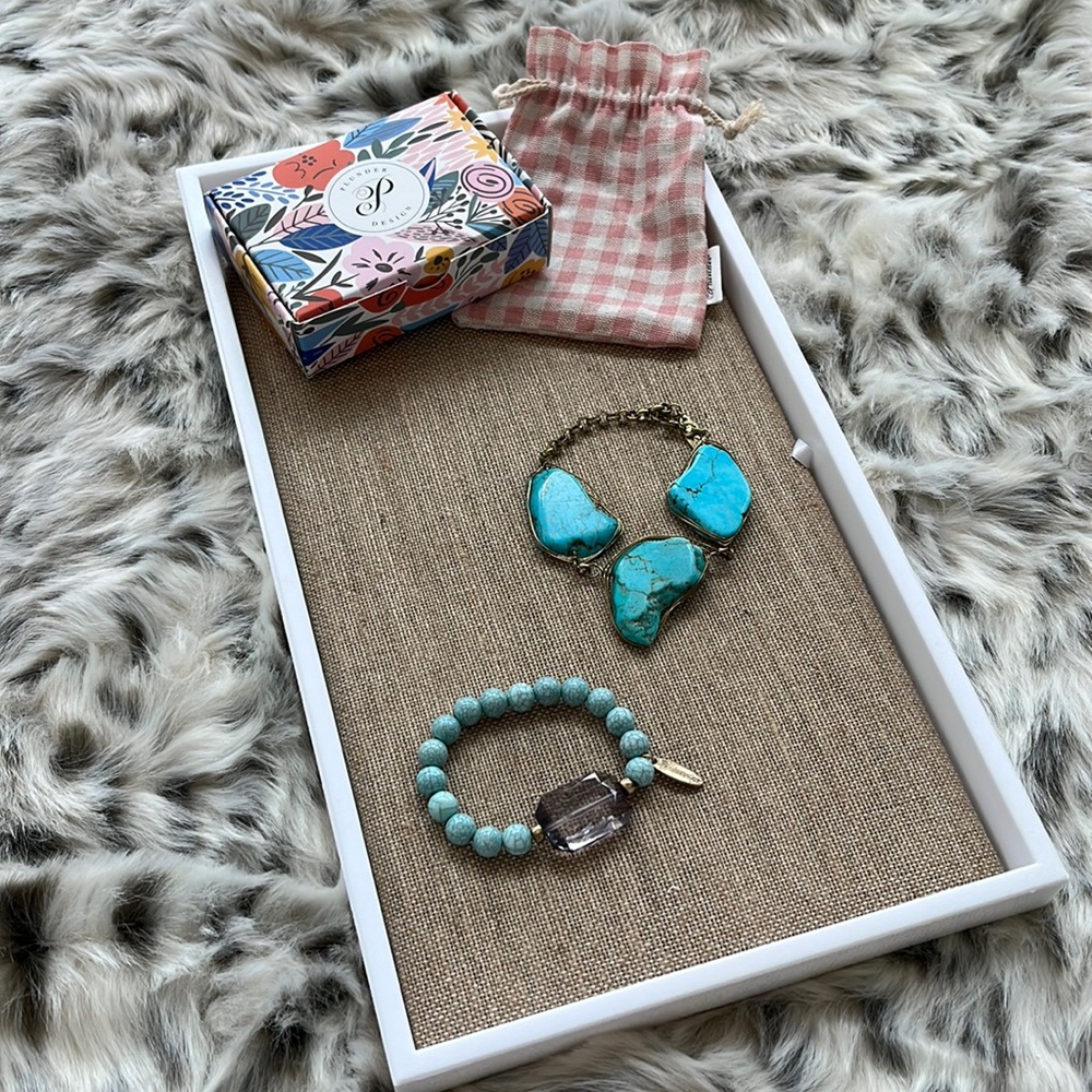 Plunder, teal bracelet, lol gold medaling one with a gemstone